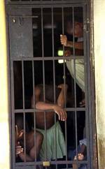 [image: Haitian prisoners being held before trial in a jail cell at a police station in Port-au-Prince. UN Photo# 187325C]